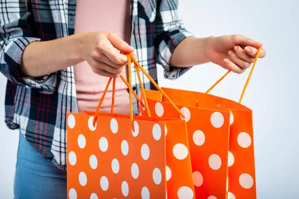 Bags hands opening polka dot shopping bags 23 2148316658